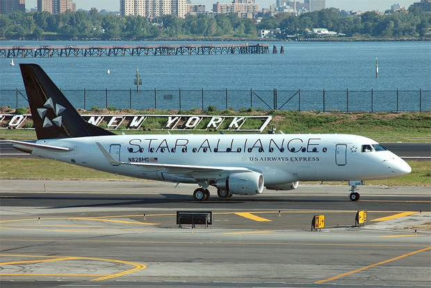 Star Alliance livery N828MD rolling east on LGA's taxiway Bravo after a morning arrival.