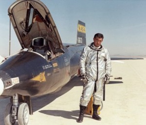 Pilot Michael J. Adams alongside the X-15. 