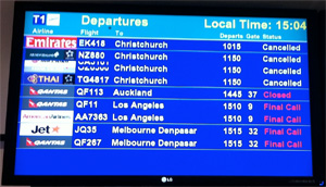 Sydney departures board shows cancelled flights to Christchurch