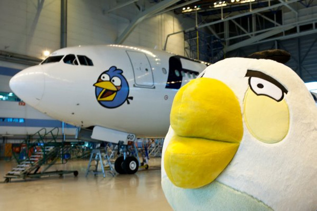 The Angry Bird known only as White Bird poses in front of his comrade Blue Bird on the side of a Finnair Airbus A340-300