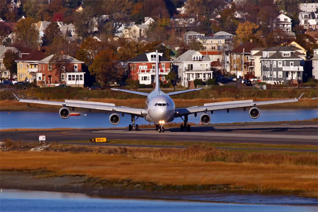Some houses facing Boston Logan Airport get a face full of jet blast as an Air France Airbus A340-300 taxis off the runway after landing