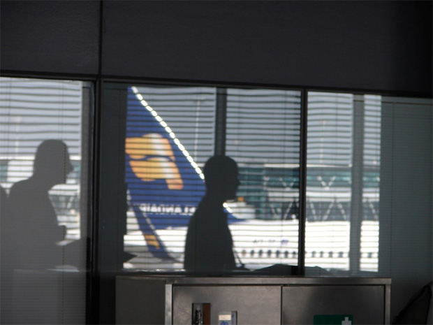 Reflection of an Icelandair Boeing 757 in an Amsterdam Schiphol window.
