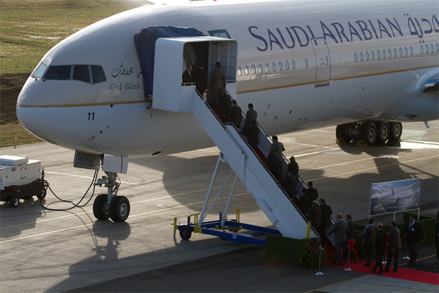 Saudi and Boeing officials climb aboard the new plane, Boeing 777-300ER HZ-AK11